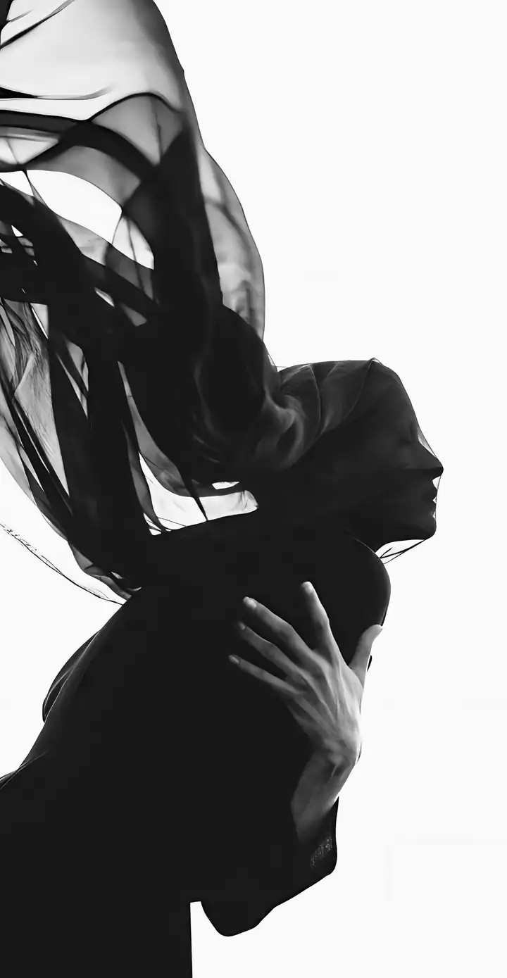 Profile of a woman veiled in sheer black fabric, one hand at her chest